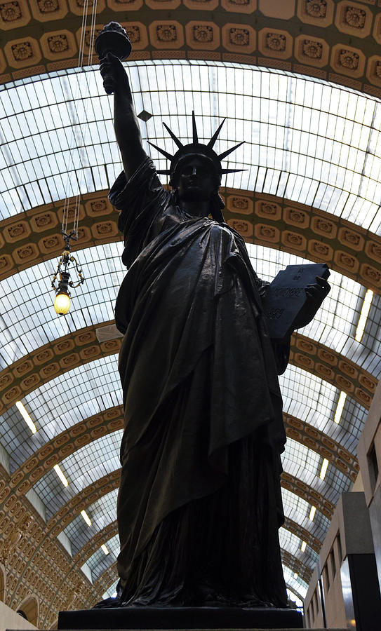 Statue of Liberty in Bronze Silhouetted Against Light of Glass Ceiling Orsay Museum Paris Photograph by Shawn OBrien