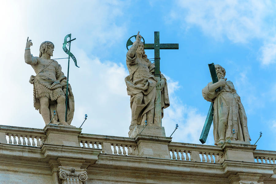 Statues above St. Peter Basilica in Rome. Photograph by Marek Poplawski