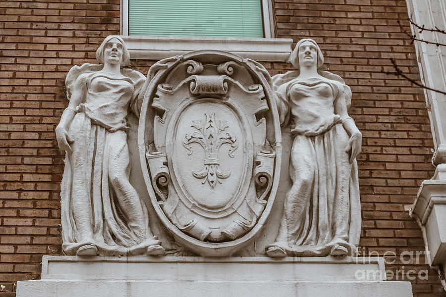 Statues on the wall of old building in Washington DC Photograph by Claudia M Photography