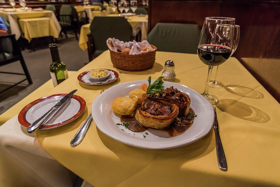 Steak dinner with wine on restaurant table Photograph by Ndp | Fine Art