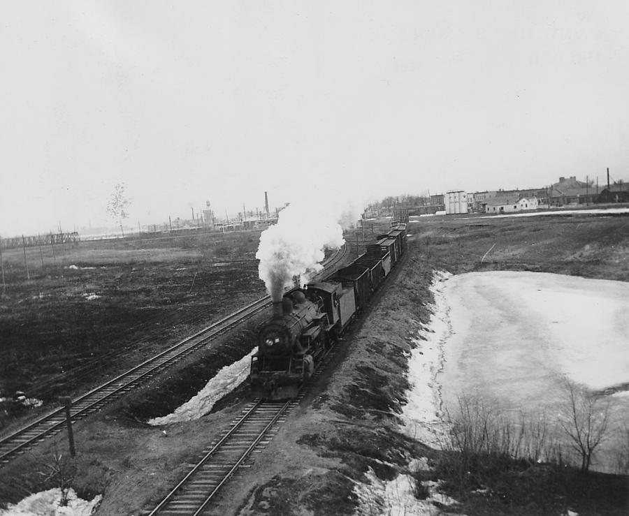 Steam Engines Photograph - Steam Locomotive Chugging Away from Community  by Chicago and North Western Historical Society