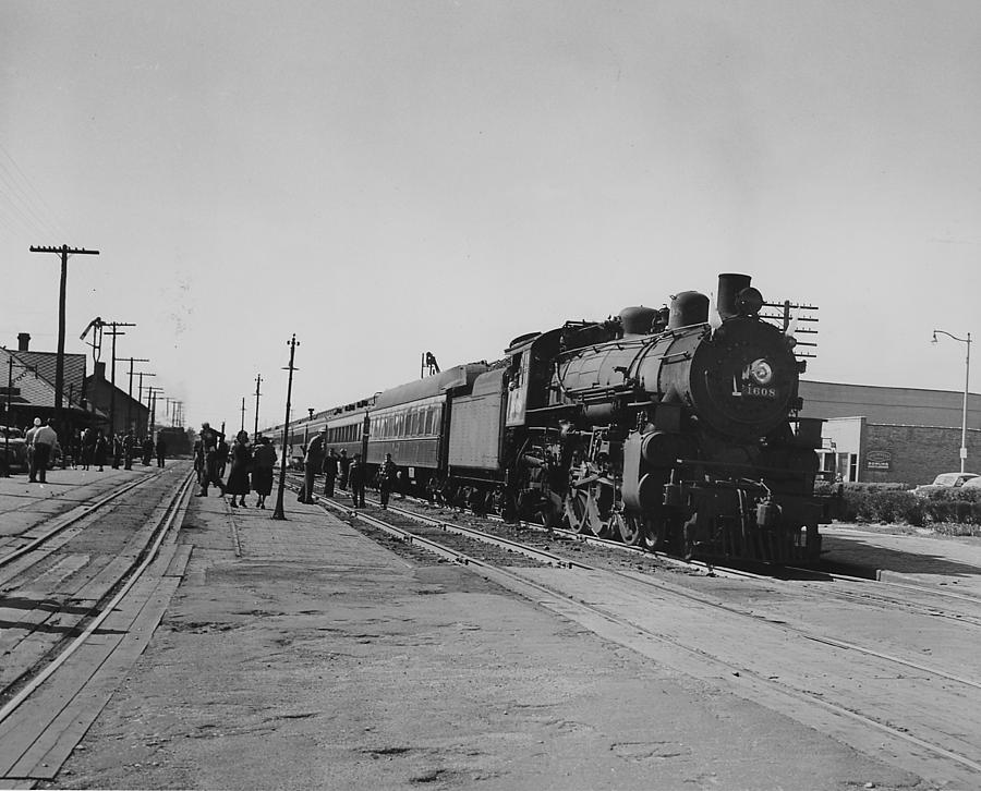 Steam Train in Small Business District Photograph by Chicago and North Western Historical Society