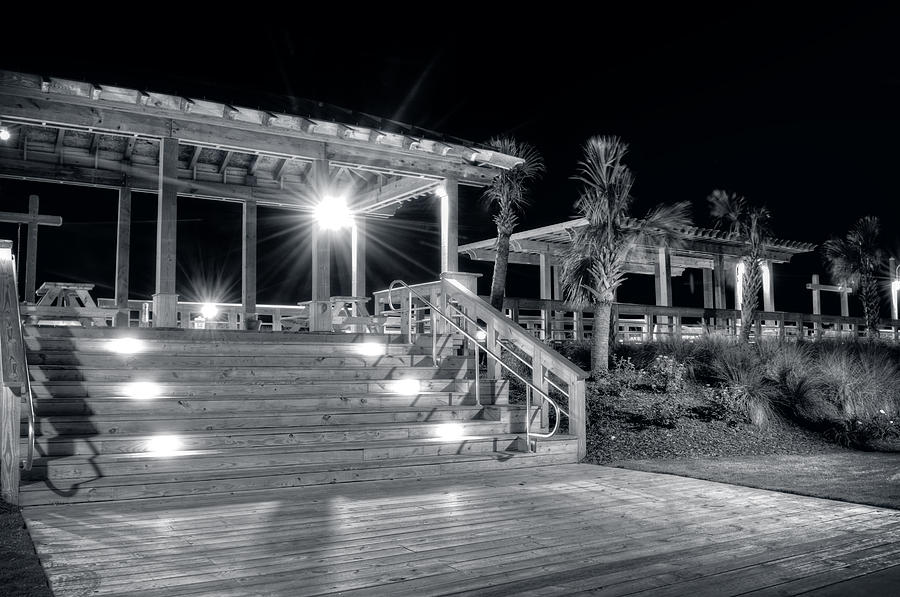 Steps Up To The Carolina Beach Boardwalk At Night in Black and W Photograph by Greg and Chrystal Mimbs