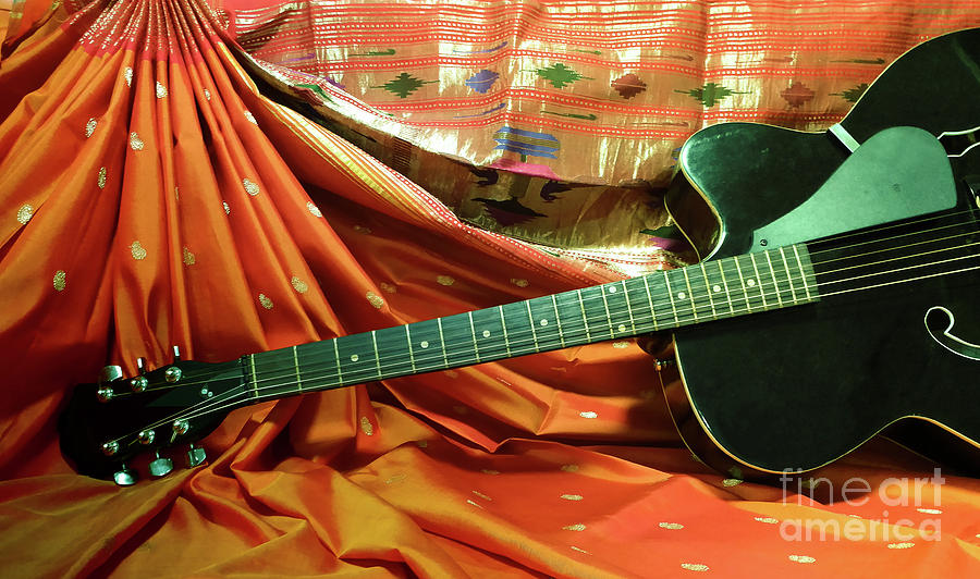 Still life of guitar with India traditional saree at background Photograph by Kiran Joshi