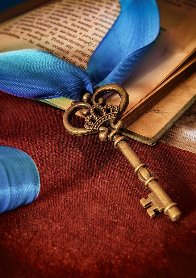 Still life with brass ornamented key and blue ribbon Photograph by Jaroslaw Blaminsky