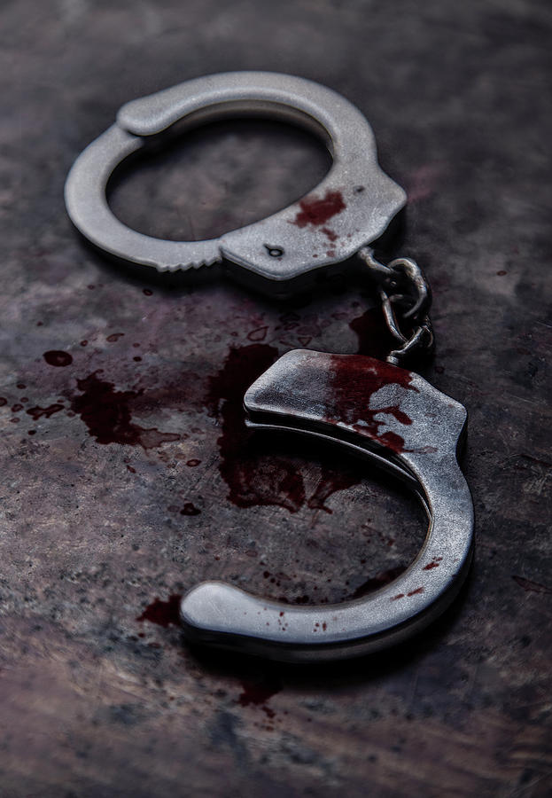 Still life with broken handcuffs and marks of blood Photograph by Jaroslaw Blaminsky