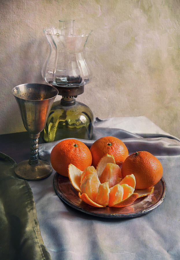 Still life with fresh tangerines and oil lamp Photograph by Jaroslaw Blaminsky