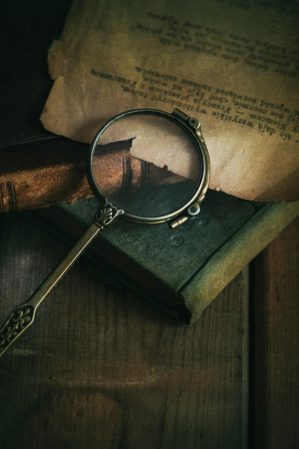 Still life with old books and vintage loupe Photograph by Jaroslaw Blaminsky