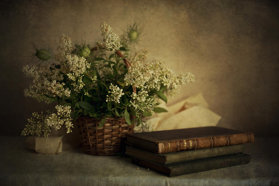 Still Life Photograph - Still life with old books and white flowers in the basket by Jaroslaw Blaminsky