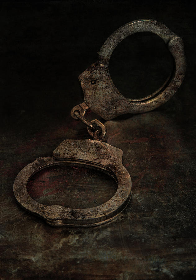 Still life with old rusty handcuffs Photograph by Jaroslaw Blaminsky