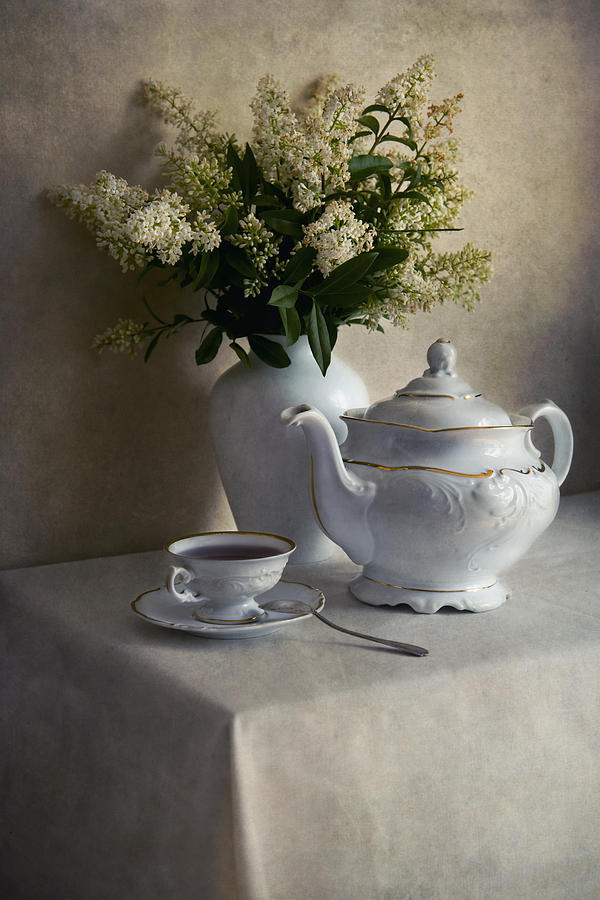 Still life with white tea set and bouquet of white flowers Photograph by Jaroslaw Blaminsky