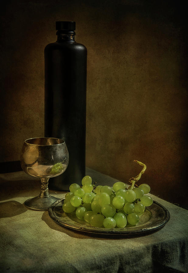Still life with wine and green grapes Photograph by Jaroslaw Blaminsky