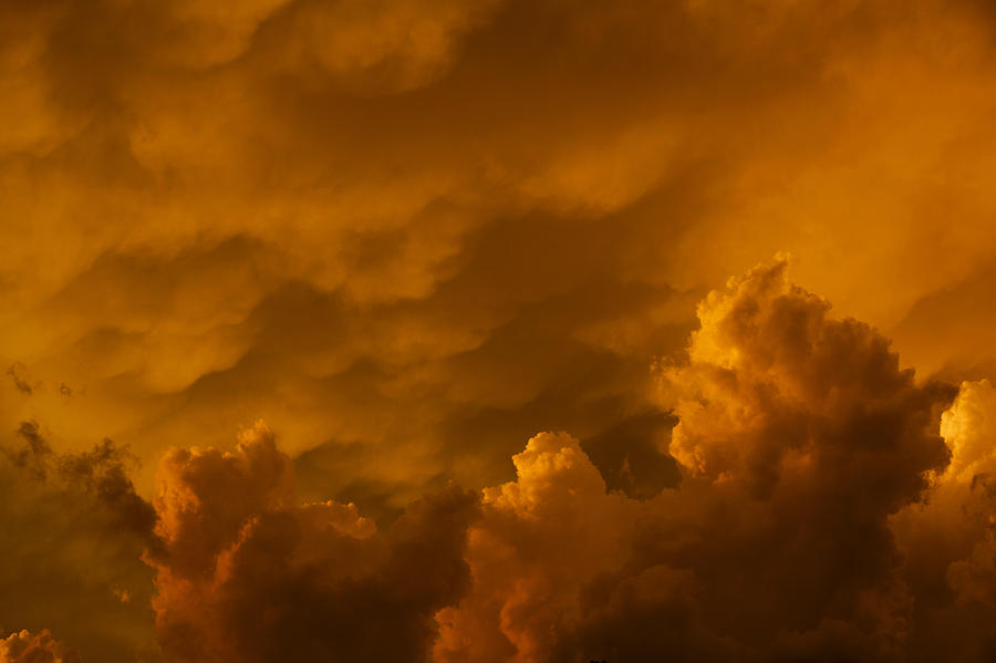 Storm clouds at sunset Photograph by Steve Gravano