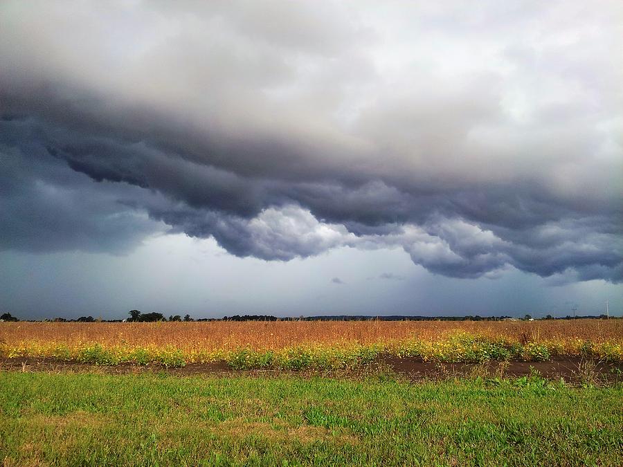 Storm Clouds Over a Field Photograph by Lorraine Price