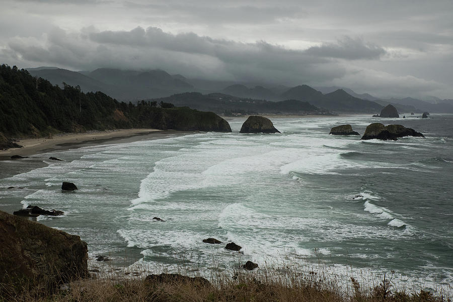 Storm Clouds over Cannon Beach Photograph by Tom Cochran