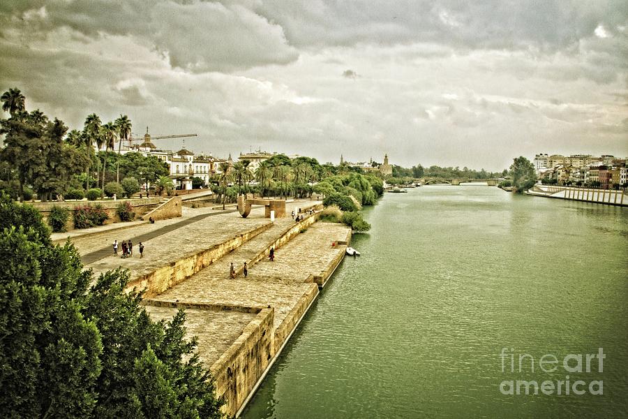 Storm Clouds over the Guadalquivir-Seville Photograph by Mary Machare