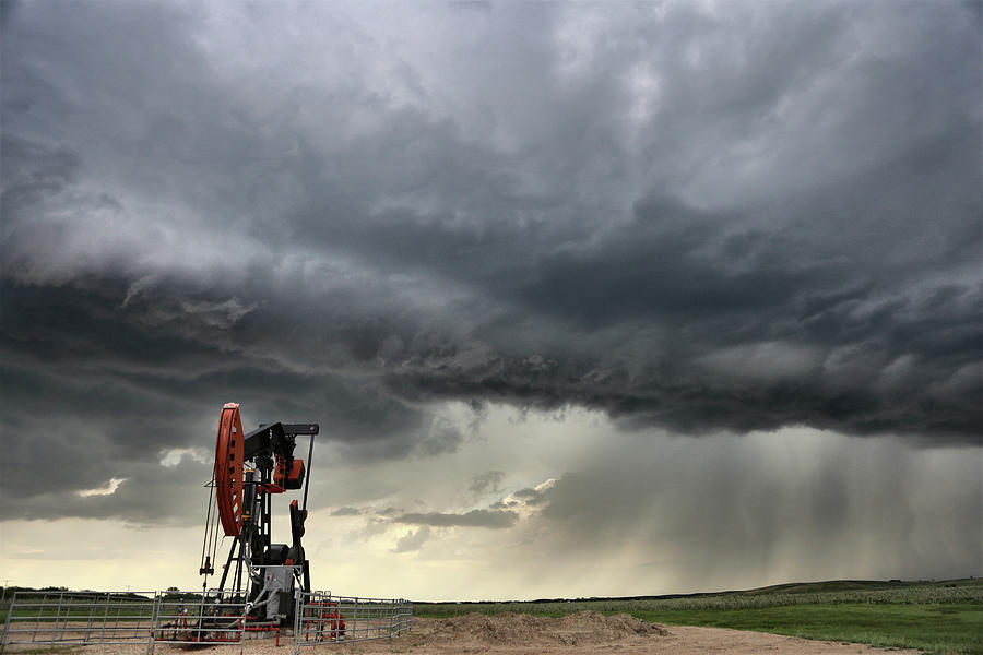  Storm Oil Field Pump Jack Photograph by Mark Duffy