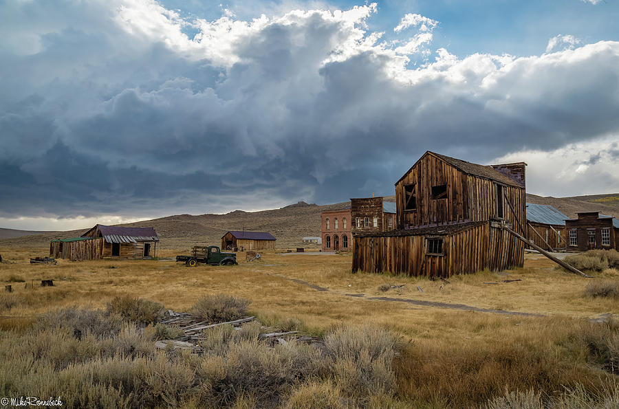 Storm over Bodie Photograph by Mike Ronnebeck