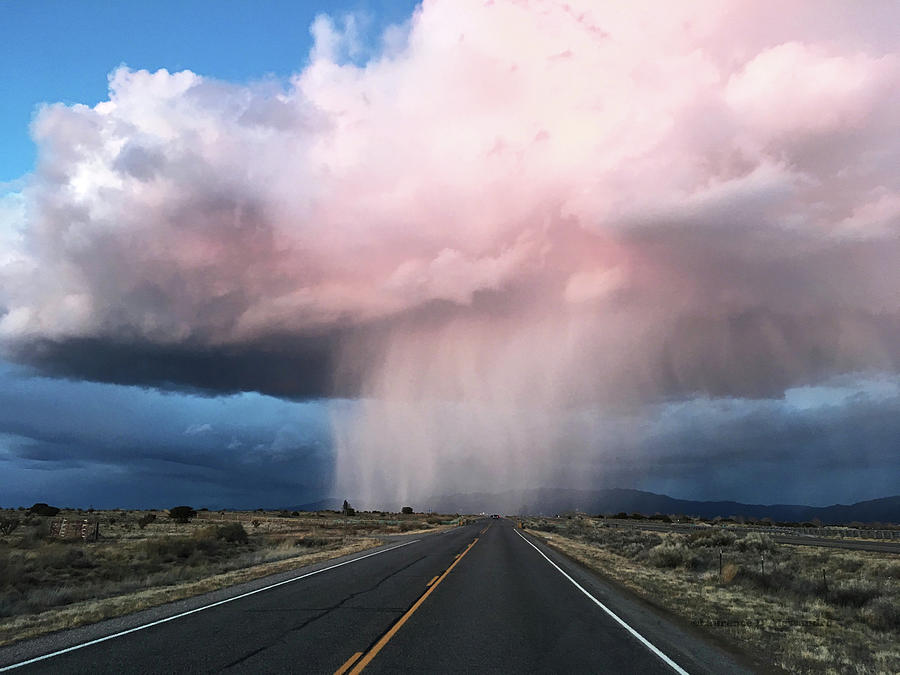 Storm over Santa Fe Photograph by Carolyn DAlessandro