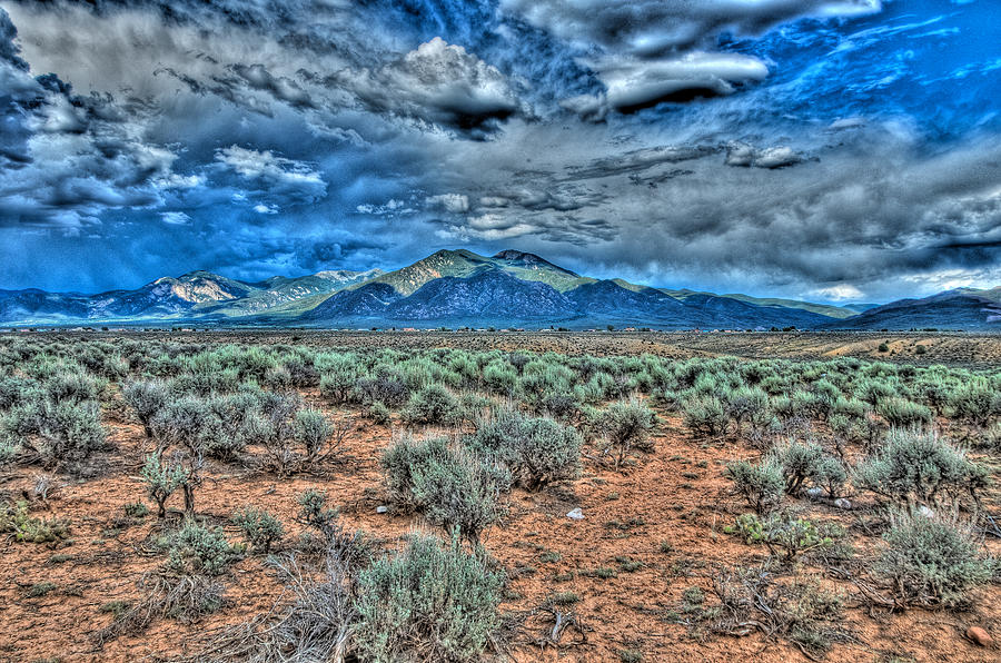 Storm over Taos mountain Photograph by Charles Muhle