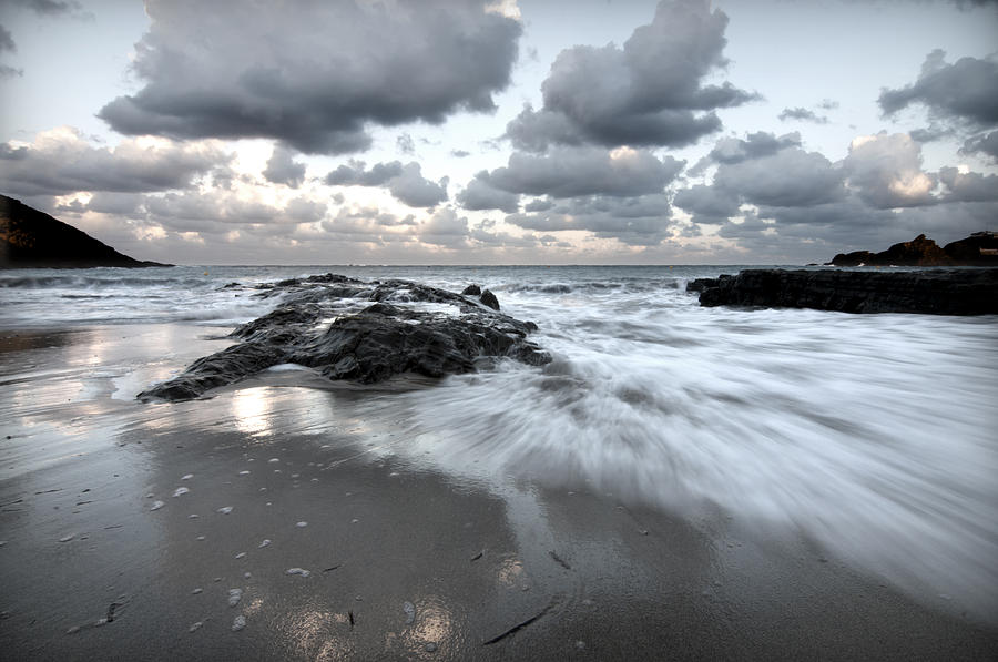 Stormy Beach 2 - Cala Mesquida north coast of menorca after storm a cloudy and bluish landscape Photograph by Pedro Cardona Llambias