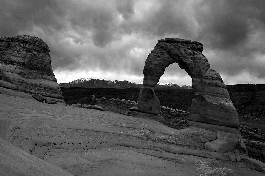 Stormy Delicate Arch Black and white Photograph by Pierre Leclerc Photography
