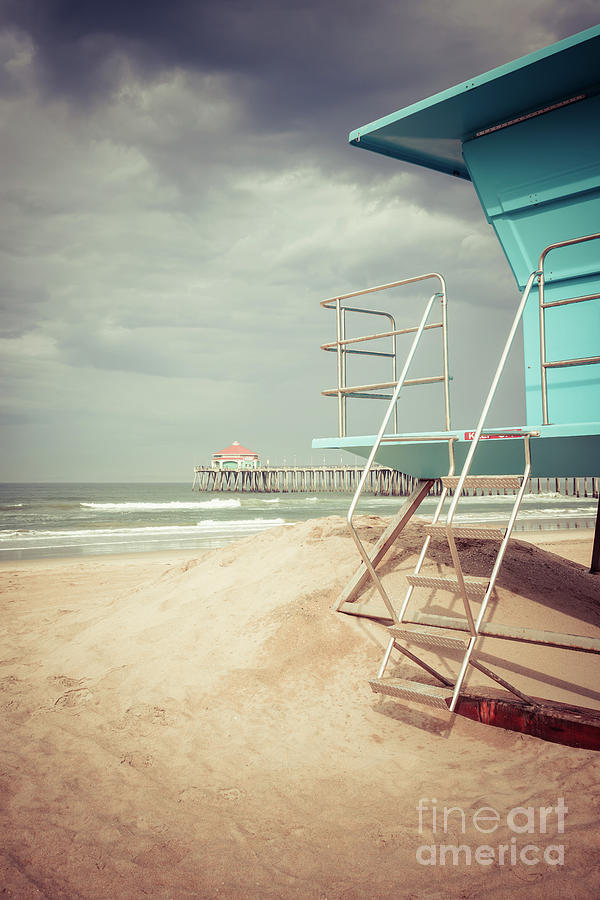Stormy Huntington Beach Pier and Lifeguard Stand Photograph by Paul Velgos
