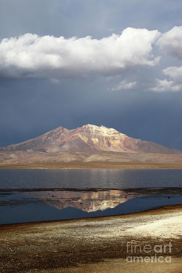 Stormy Skies Quisi Quisini volcano and Lake Chungara Chile Photograph by James Brunker