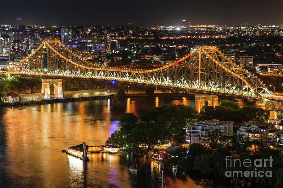 Story Bridge lit up after dark Photograph by Andrew Michael