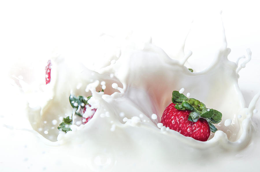 Strawberry falling in milk Photograph by Allison Ginadaio - Pixels