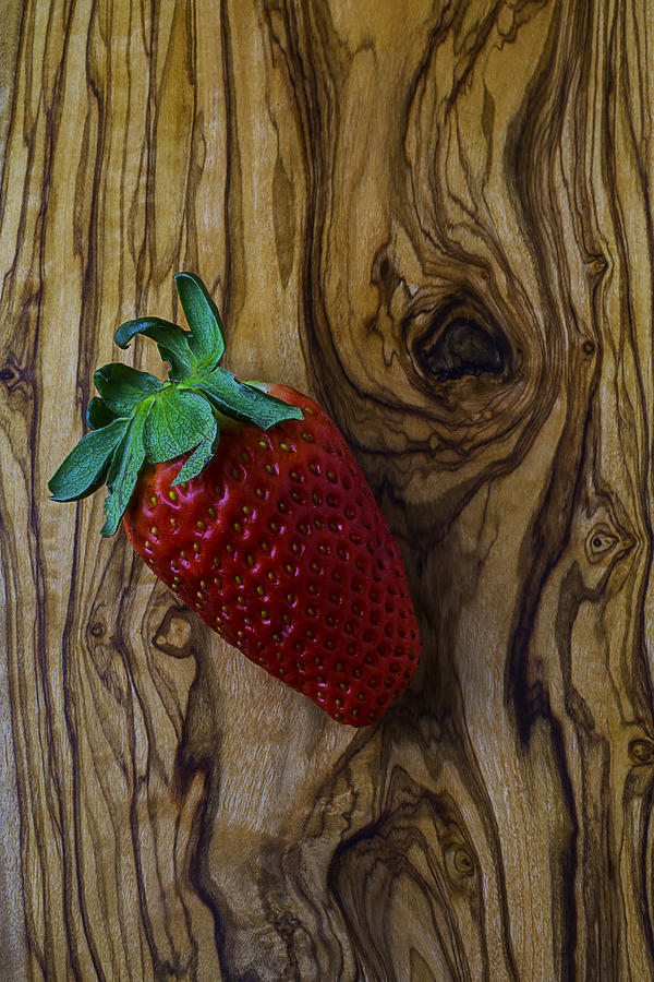 Strawberry On Wood Grain Board Photograph by Garry Gay