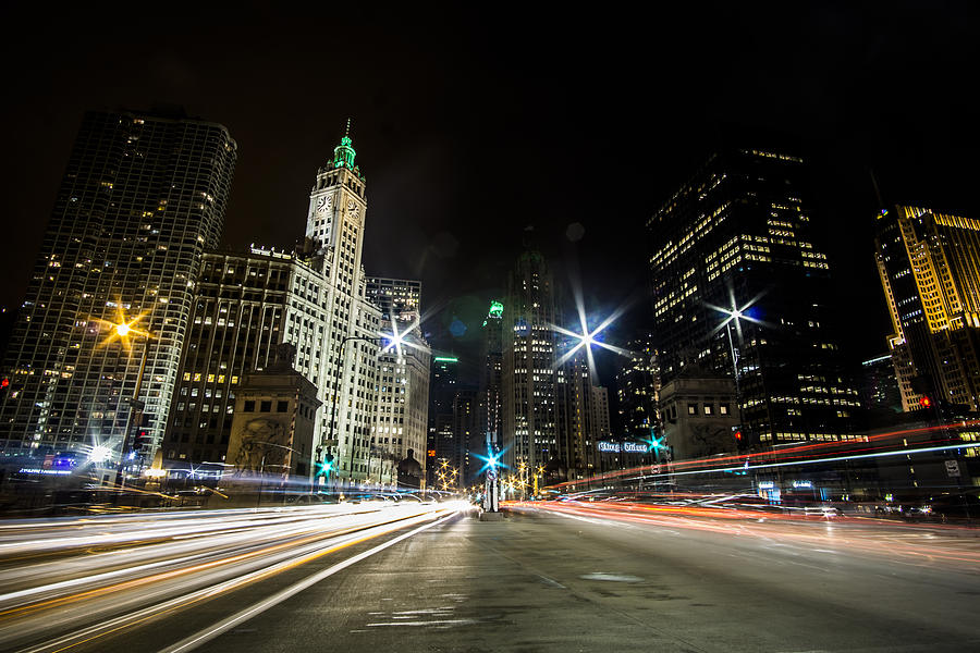 streaks of light zooming by you  on Chicagos Mag Mile Photograph by Sven Brogren