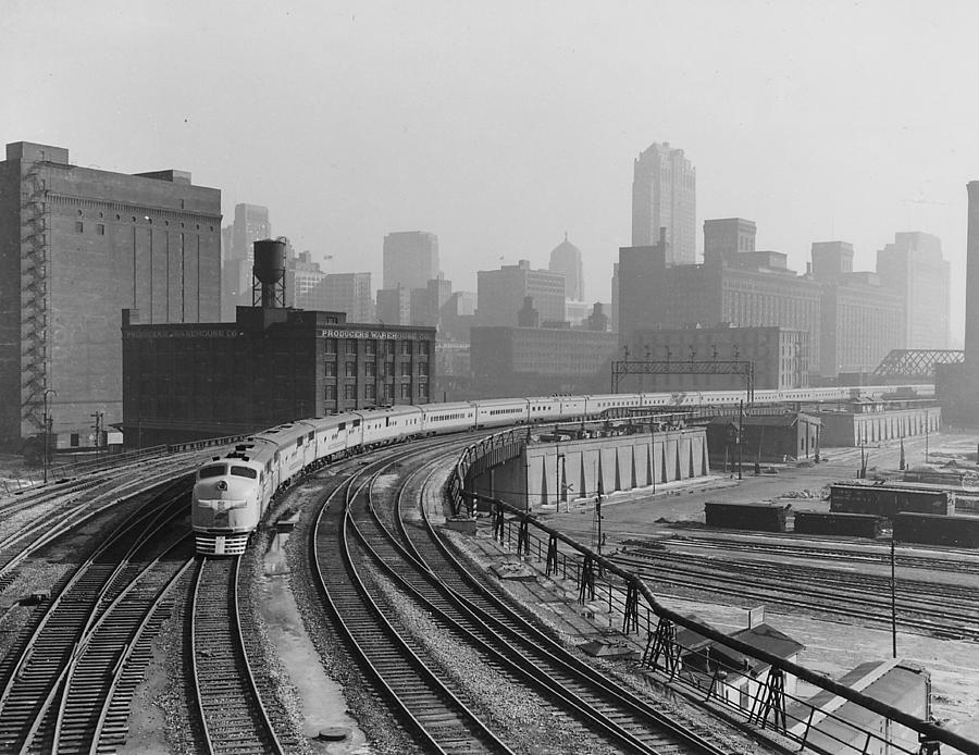 Streamlined Diesel Locomotive Passes Through Major City Photograph by Chicago and North Western Historical Society