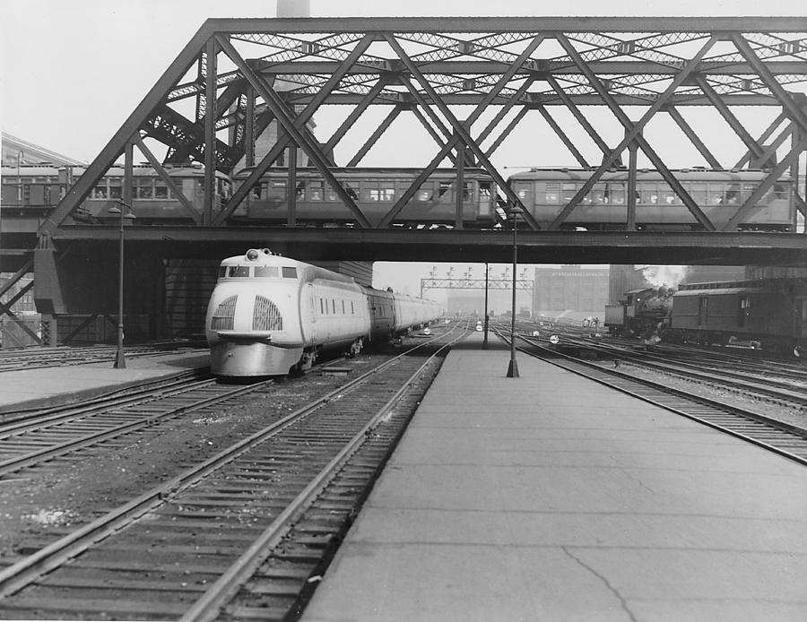 Streamlined Diesel Locomotive Passes Under Bridge Photograph by Chicago and North Western Historical Society