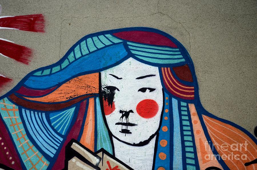 Street art graffiti of Japanese lady with colorful hair Belgrade