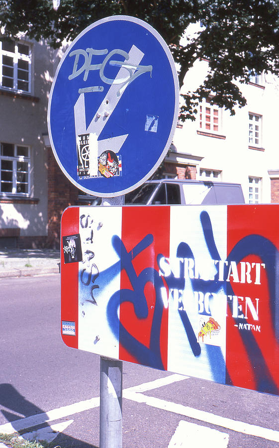 Street Sign Photograph - Street Art In Street Sign by Nacho Vega Street Sign Photograph - Street Art In Street Sign by Nacho Vega