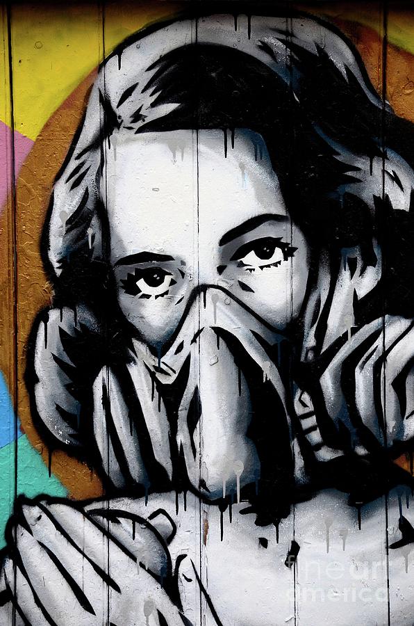 Street art wall mural graffiti of woman wearing oxygen gas mask London England Photograph by Imran Ahmed