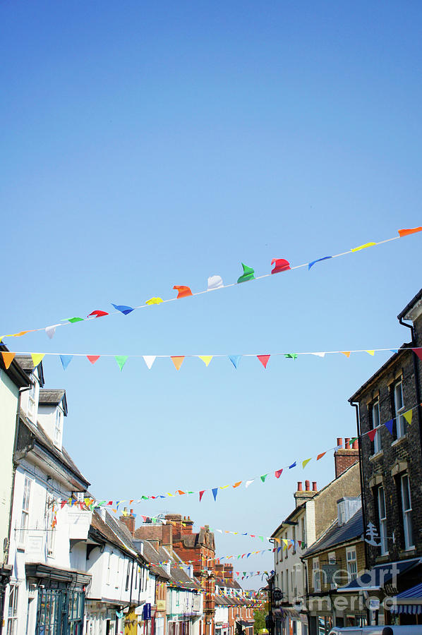 Street bunting flags Photograph by Tom Gowanlock