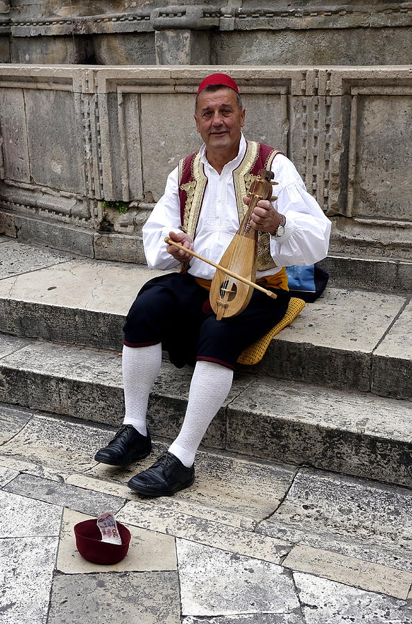 Street Performer In The Old Walled City Of Dubrovnik Croatia  Photograph by Rick Rosenshein