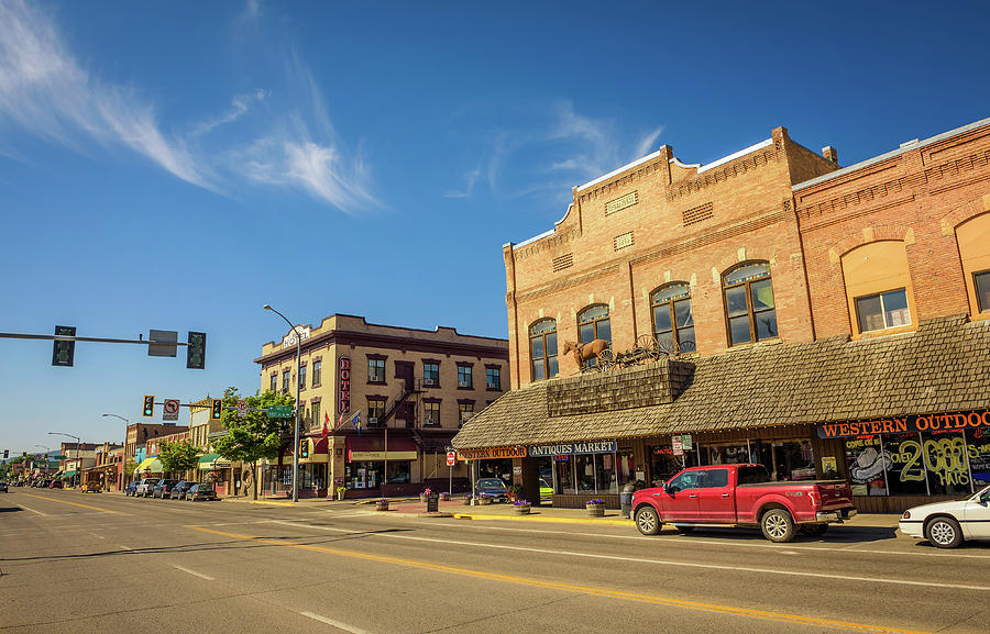 Street view with stores and hotels in Kalispell, Montana Photograph by ...