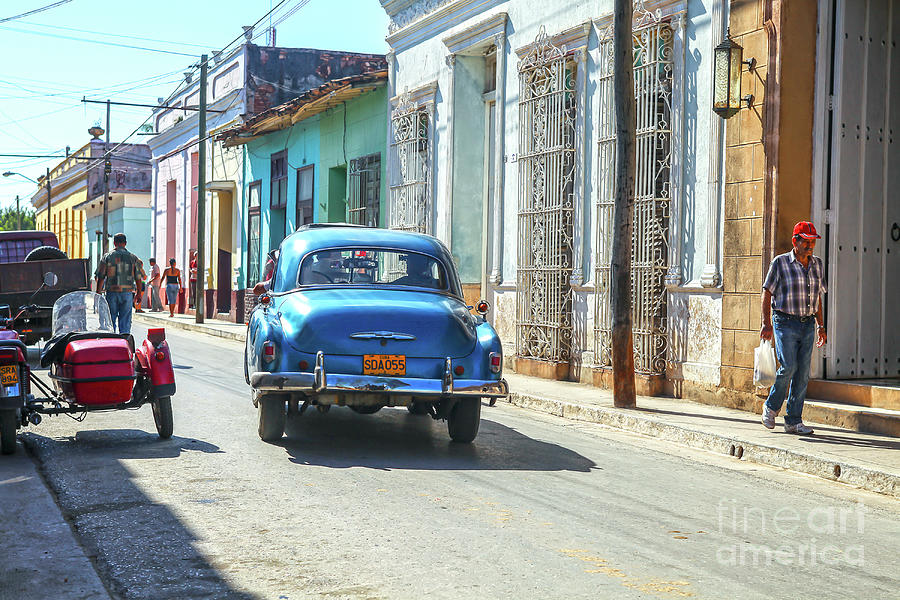 Streetlife with car in Trinidad, Cuba Photograph by Patricia Hofmeester