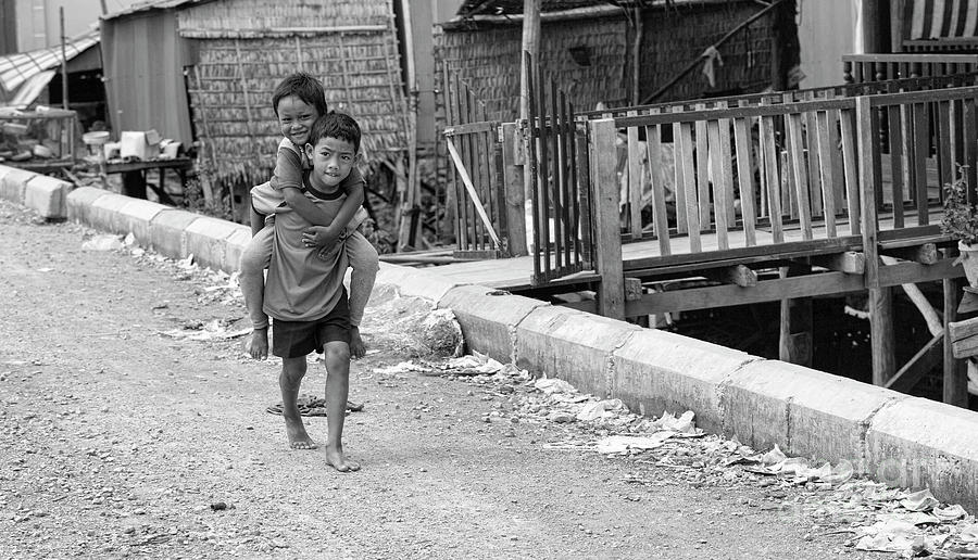 Cambodia Photograph - Streets Tonle Sap Boys Poverty  by Chuck Kuhn
