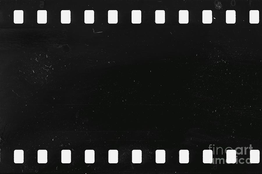 Vintage Photograph - Strip of old celluloid film with dust and scratches by Michal Boubin