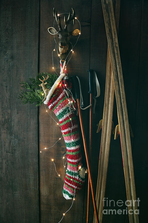 Christmas Photograph - Striped wool stocking with old skis and sparkling lights by Sandra Cunningham