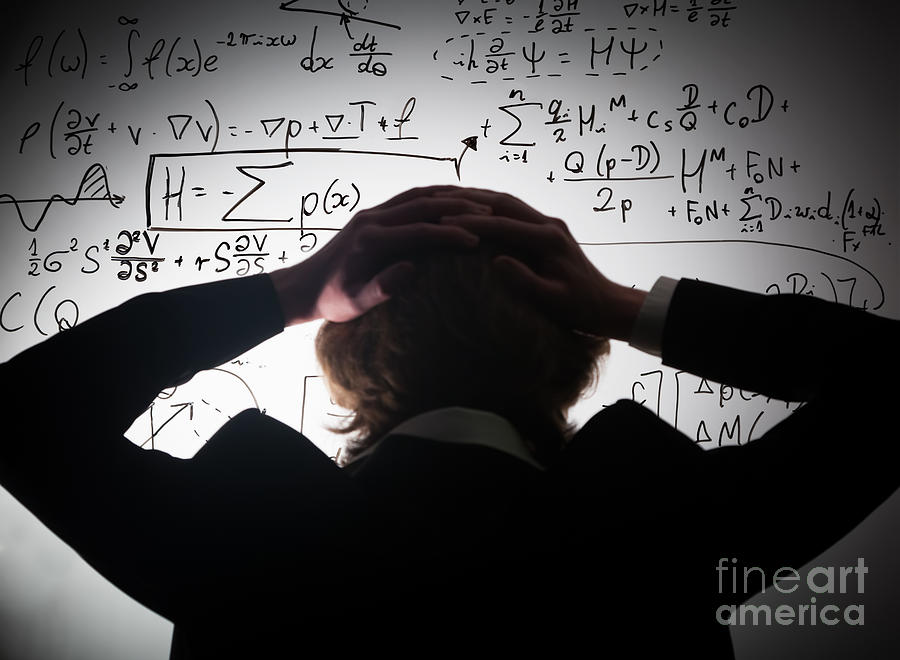 University Photograph - Student holding his head looking at complex math formulas on whiteboard by Michal Bednarek