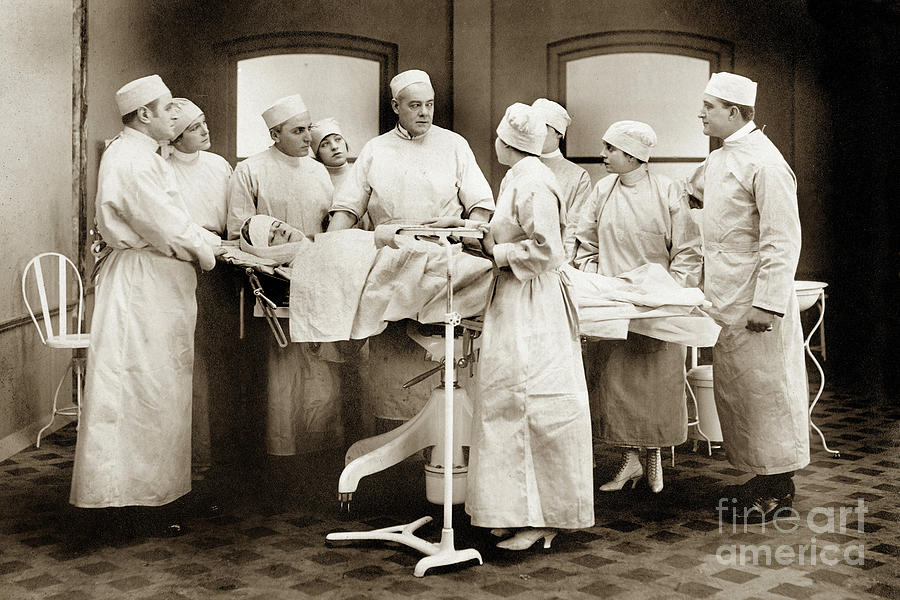 Student Nurses Photograph - Student nurses observing surgical procedures. circa 1929 by Monterey County Historical Society