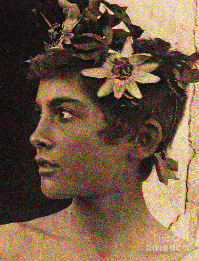 Wilhelm Von Gloeden Photograph - Study of a Sicilian boy with Passionflowers in his hair, Sicily, circa 1899 by Wilhelm von Gloeden