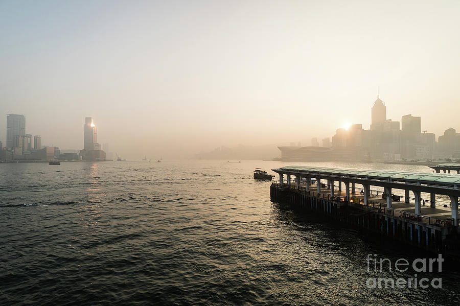Stunning sunrise over the Victoria harbor in Hong Kong. Photograph by Didier Marti