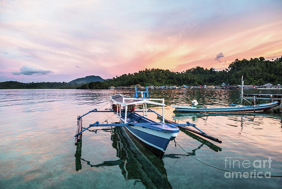 Stunning sunset over a traditional boat in Sulawesi Photograph by Didier Marti