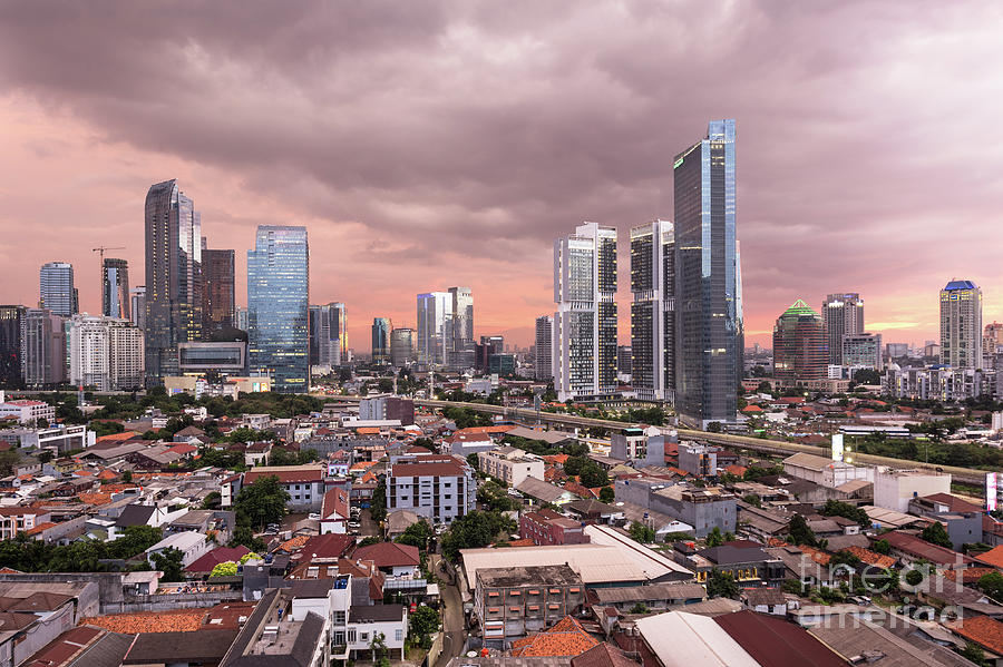 Stunning susnset over Jakarta business district in Indonesia cap Photograph by Didier Marti